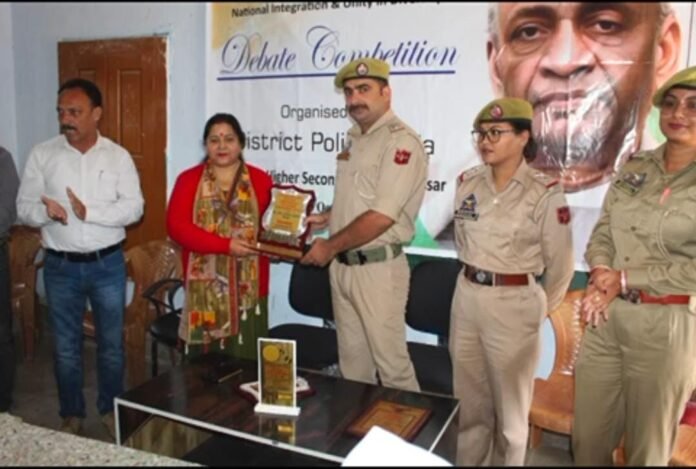 Students engaging in a debate competition at Government Higher Secondary School Assar